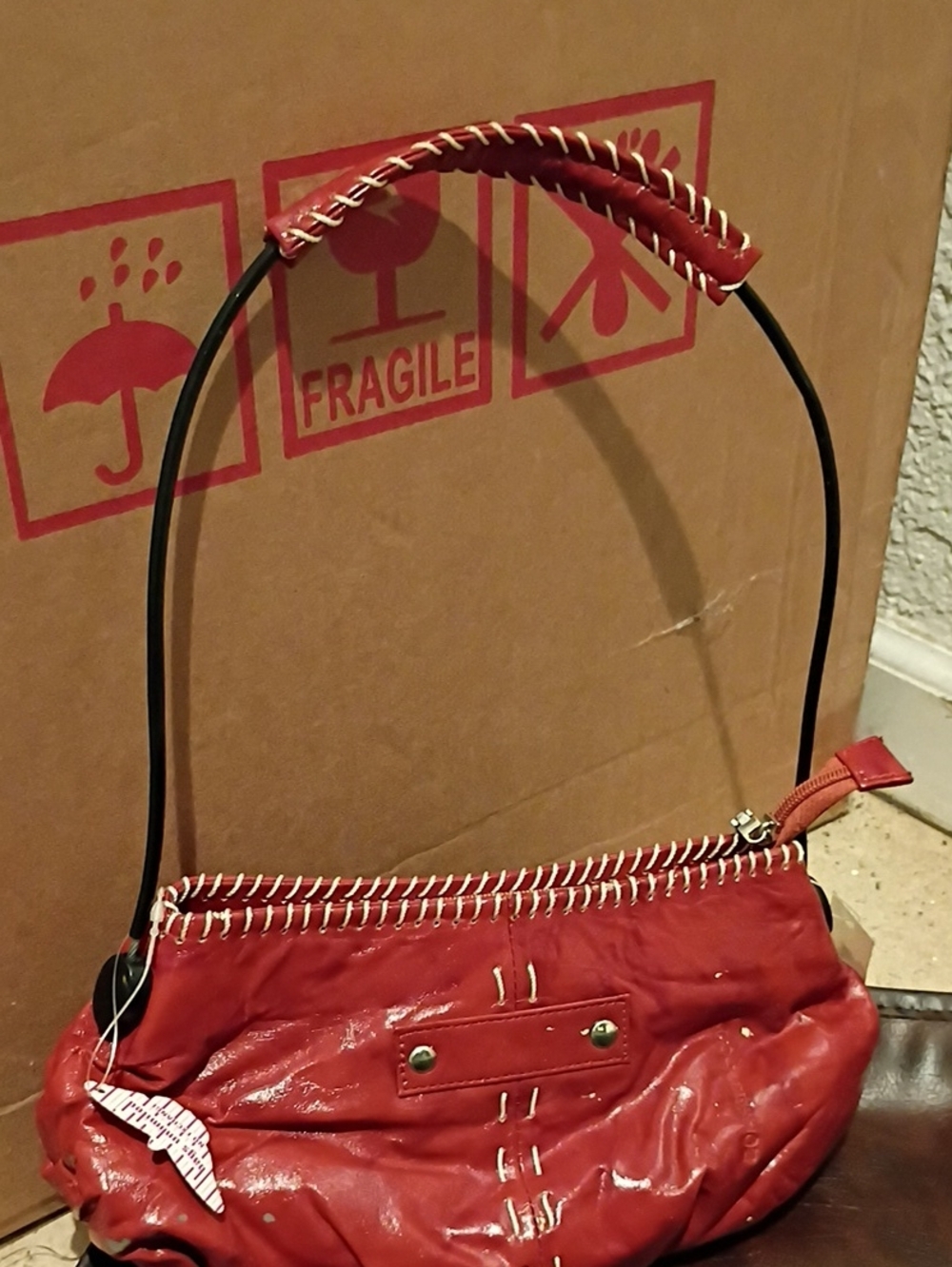 Red Shoulder Bag with Whipstitch Handle and Stud Accents